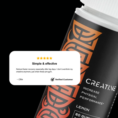 Black and orange supplement container with customer review on a white background