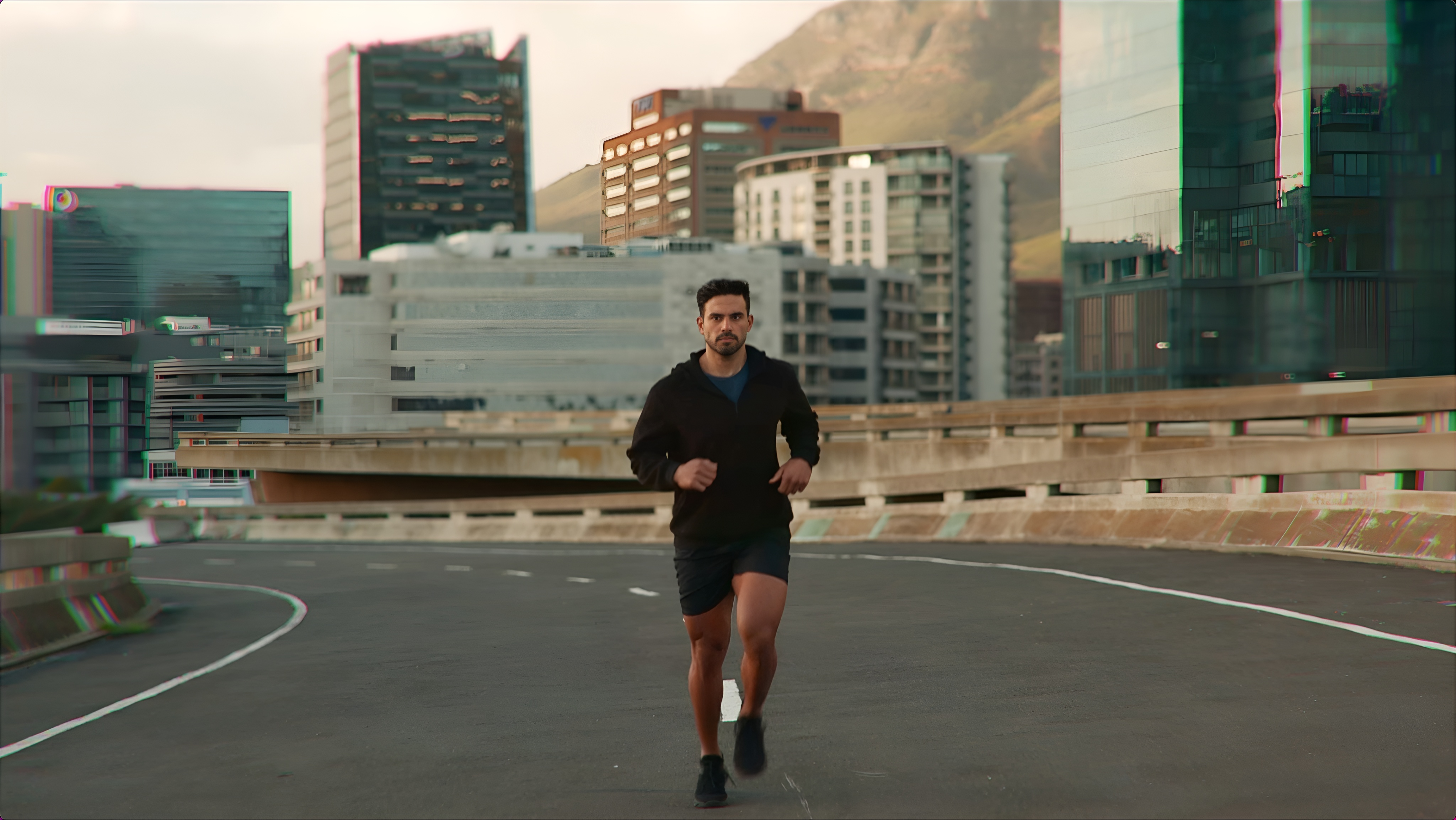 A runner training through the city at dawn
